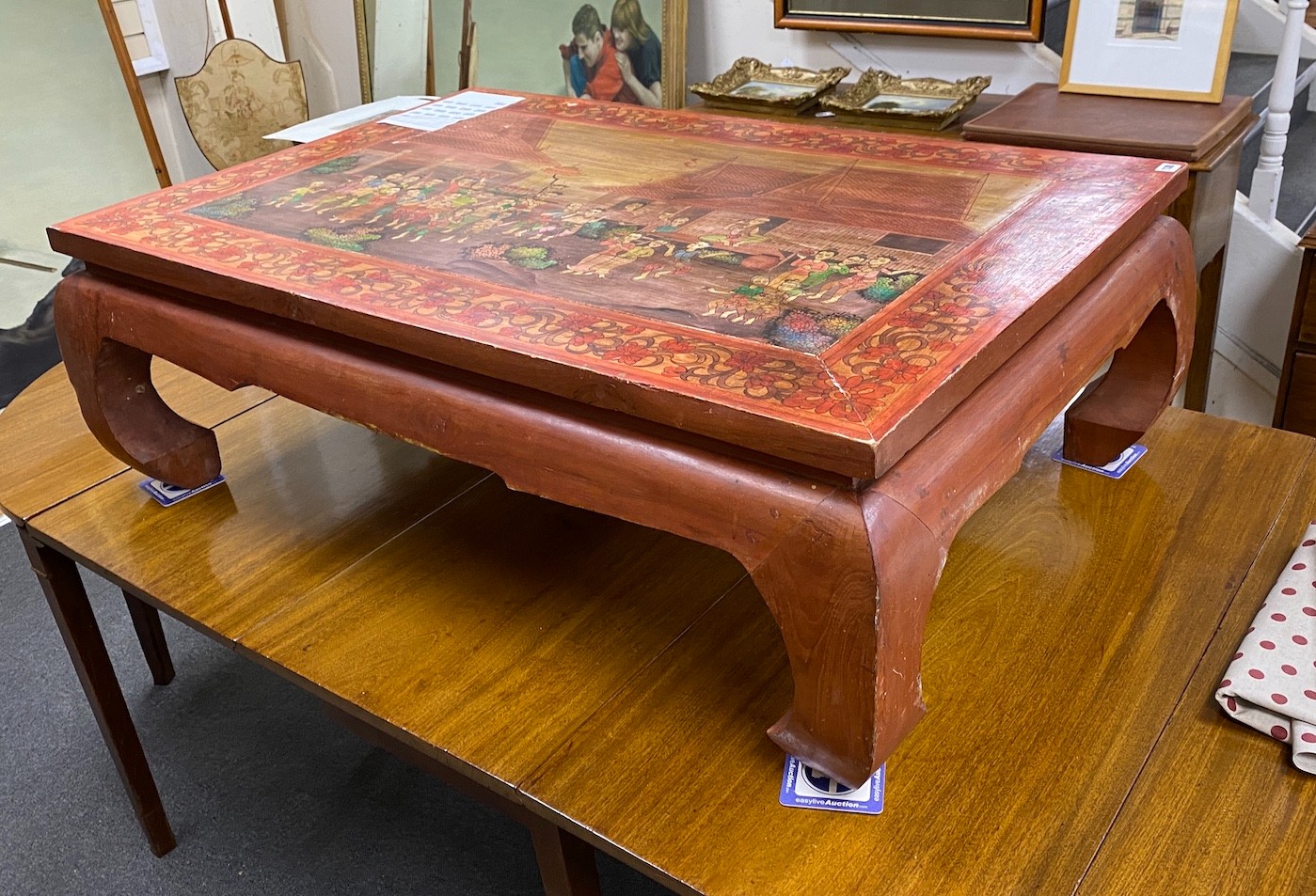 A rectangular painted Thai coffee table width 119cm, depth 79cm, height 40cm